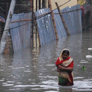https://confluence.furman.edu:8443/download/attachments/2359391/climate-change-refugees-bangladesh.jpg?version=1&modificationDate=1259926074000