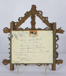 Handwritten note on the back with information on the portraits