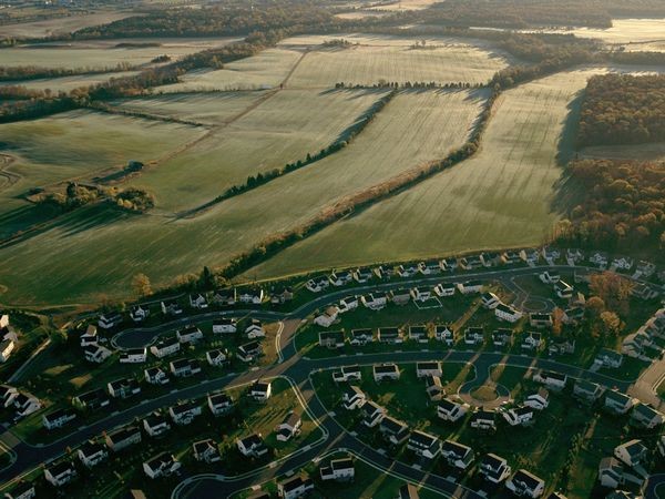 Ariel view of farm and suburb