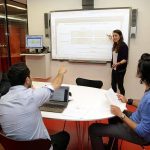 group of students working together in a study room