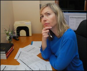 Women at desk thinking