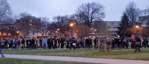 marchers with signs and placards on OSU oval Peaceful march for Justice and End to Discrimination at Ohio State University Oval called by #CBUS2FERGUSON, December 8, 2014.