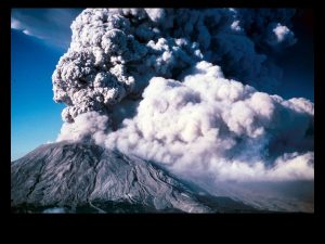 Cloud of volcanic ash rising above an erupting composite volcano