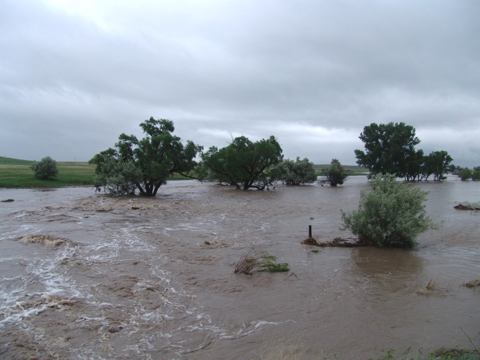 Stream valley with wide, turbulent muddy flow